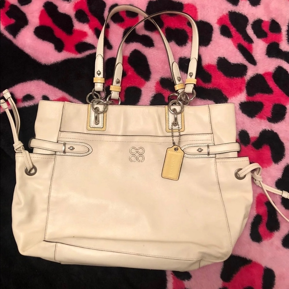 cream coach purse